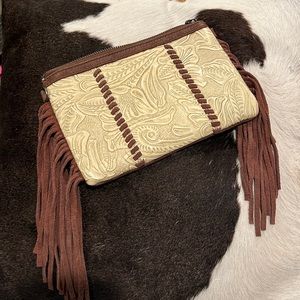 Tooled leather side fringe crossbody. Brand new without tags.